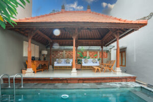 Poolside gazebo and sun loungers overlooking a private pool at Cahaya Villa Sanur